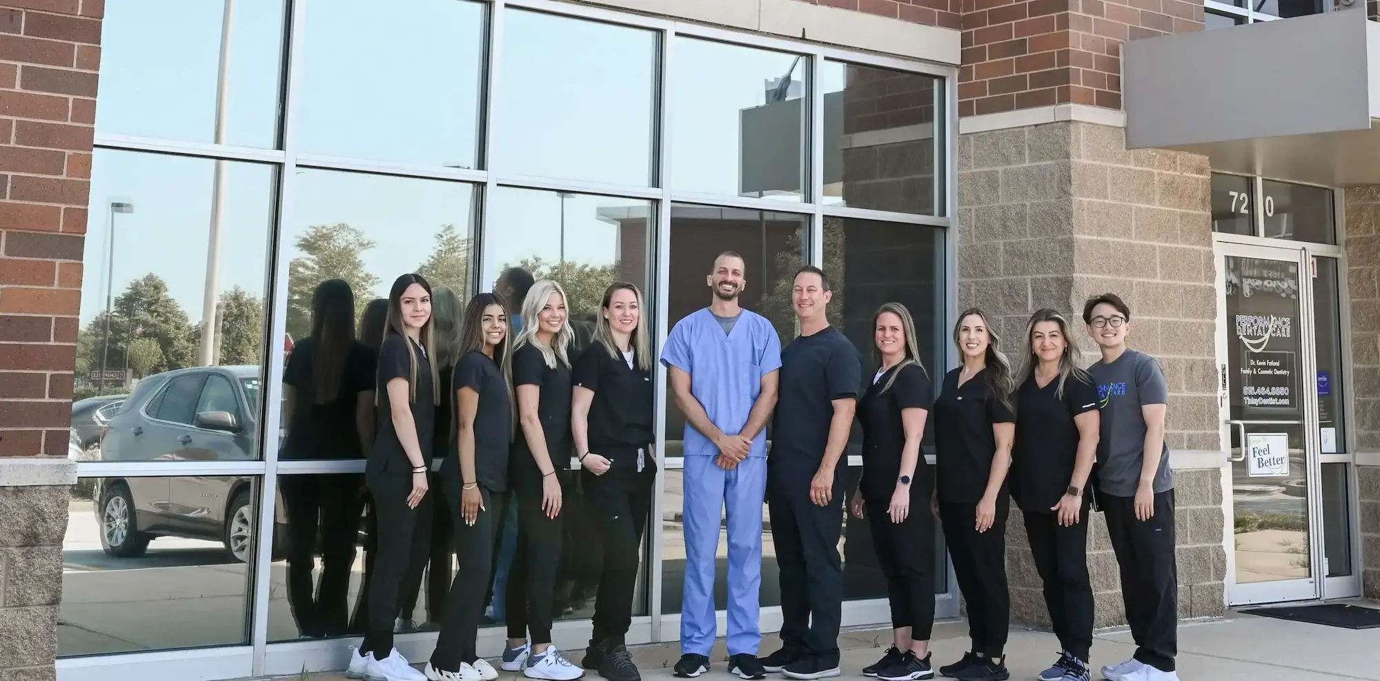 Home 1 Dr. Kevin Fatland and the Performance Dental Care family team outside their Tinley Park dental office entrance